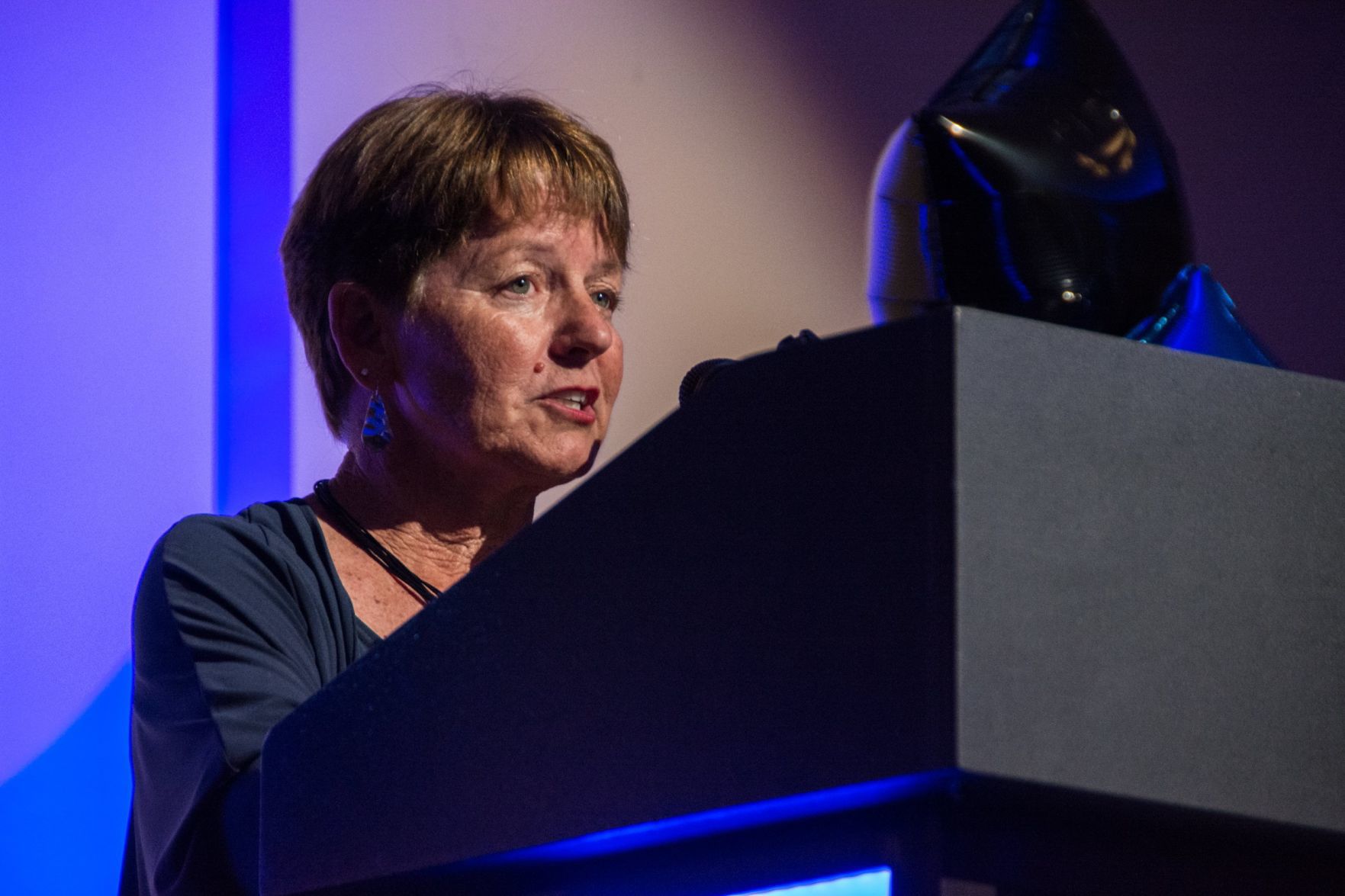 Jan Stuckey, Co-Founder of the organization, speaks at the event
